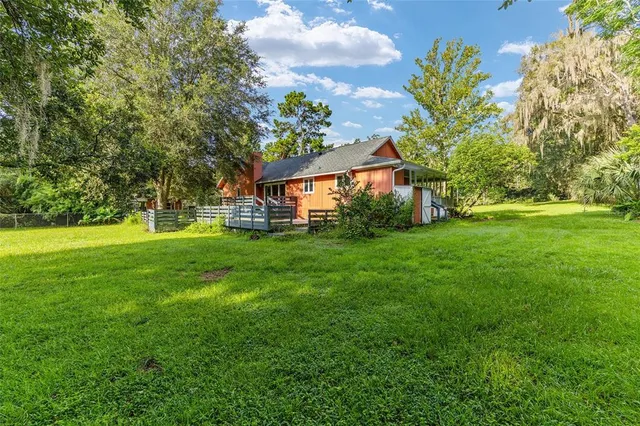 a view of a city with lush green forest