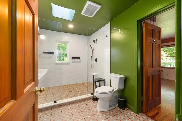 a view of an empty room with a fireplace