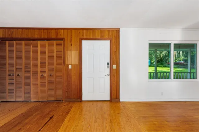a view of an empty room with a fireplace