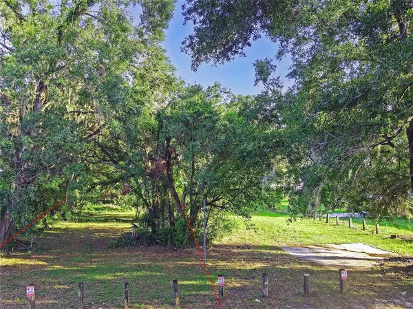a view of outdoor space with deck and yard