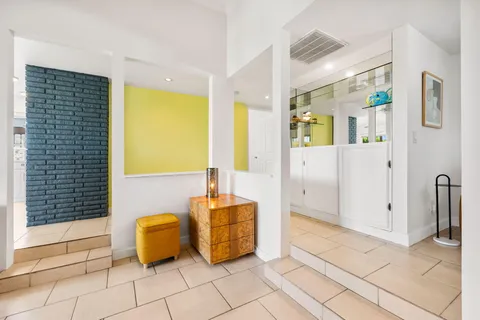 a view of a bathroom with tub shower