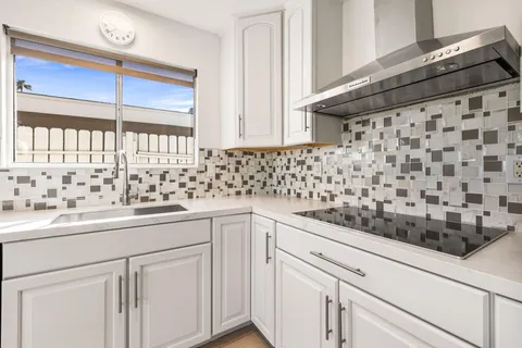 a kitchen with a sink and cabinets