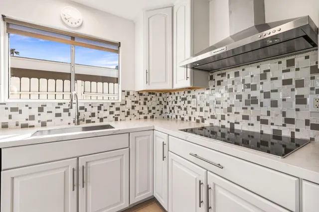 a kitchen with a sink and cabinets