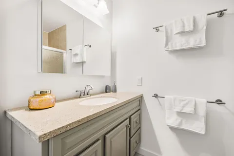 a bathroom with a sink and a vanity