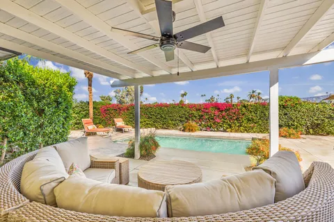 a outdoor living space with furniture and garden view