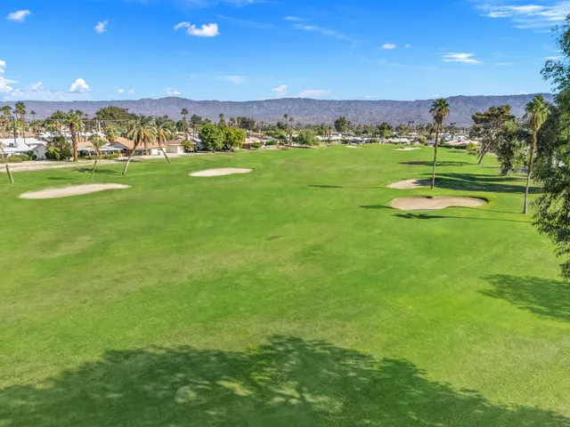 a view of a golf course with a big yard