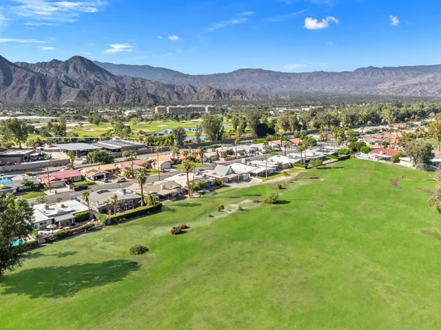a view of a city with mountains in the background