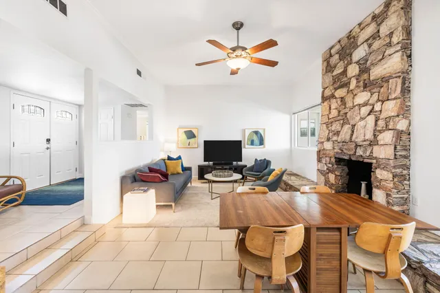 a living room with furniture and a fireplace