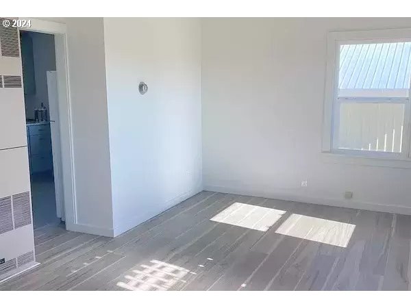 30251 South Stuwe Road Canby, OR 97013 - Photo 23 of 41 an empty room with wooden floor and windows