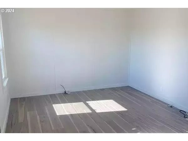 30251 South Stuwe Road Canby, OR 97013 - Photo 24 of 41 an empty room with wooden floor