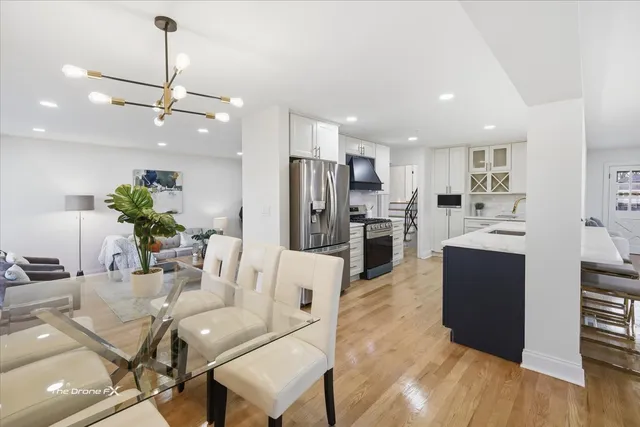 a living room with kitchen island furniture and a kitchen view