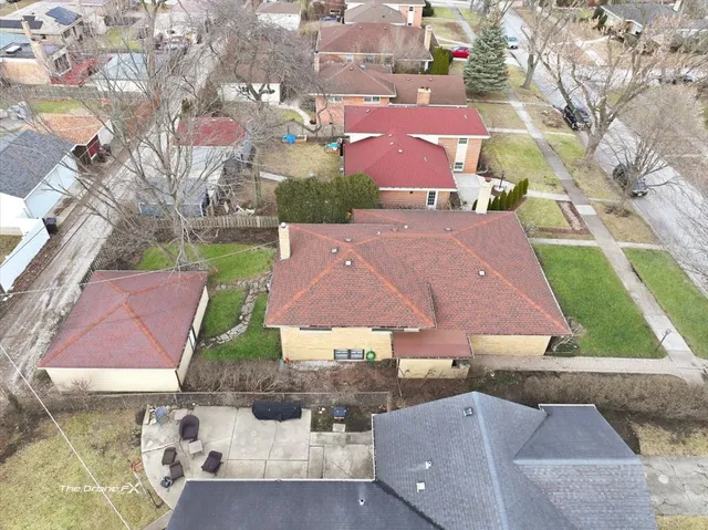 an aerial view of house with yard