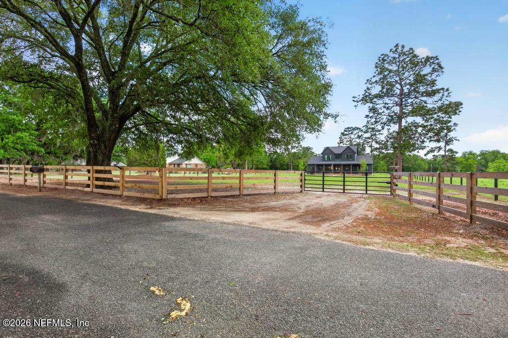 2955 Carroll Corner Road Hilliard, FL 32046 - Photo 6 of 106 a view of a yard with a trampoline