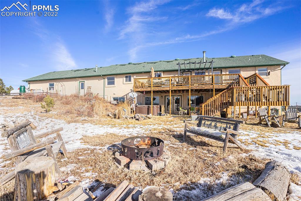 10695 Walker Road Colorado Springs, CO 80908 - Photo 40 of 49 a view of a house with backyard porch and sitting area