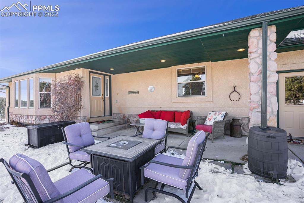 10695 Walker Road Colorado Springs, CO 80908 - Photo 41 of 49 a living room with furniture and a window
