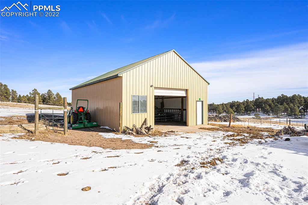 10695 Walker Road Colorado Springs, CO 80908 - Photo 42 of 49 a view of a house with snow on the ground