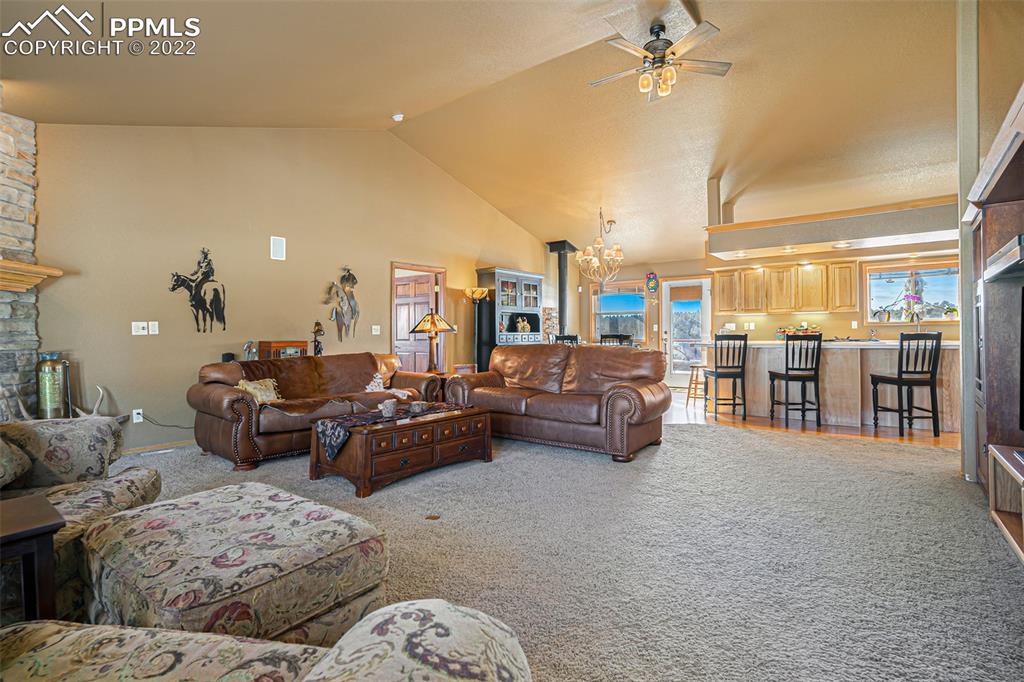 10695 Walker Road Colorado Springs, CO 80908 - Photo 7 of 49 a living room with furniture and kitchen view
