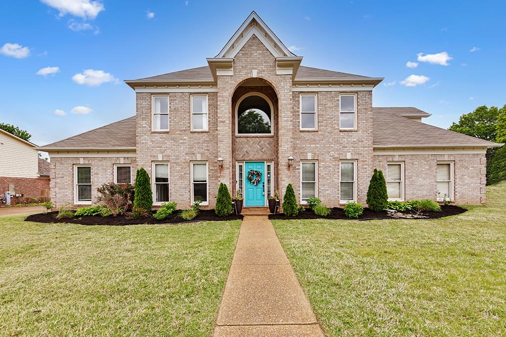 1331 Wahkin Road Collierville, TN 38017 - Photo 1 of 25 a front view of a house with a yard