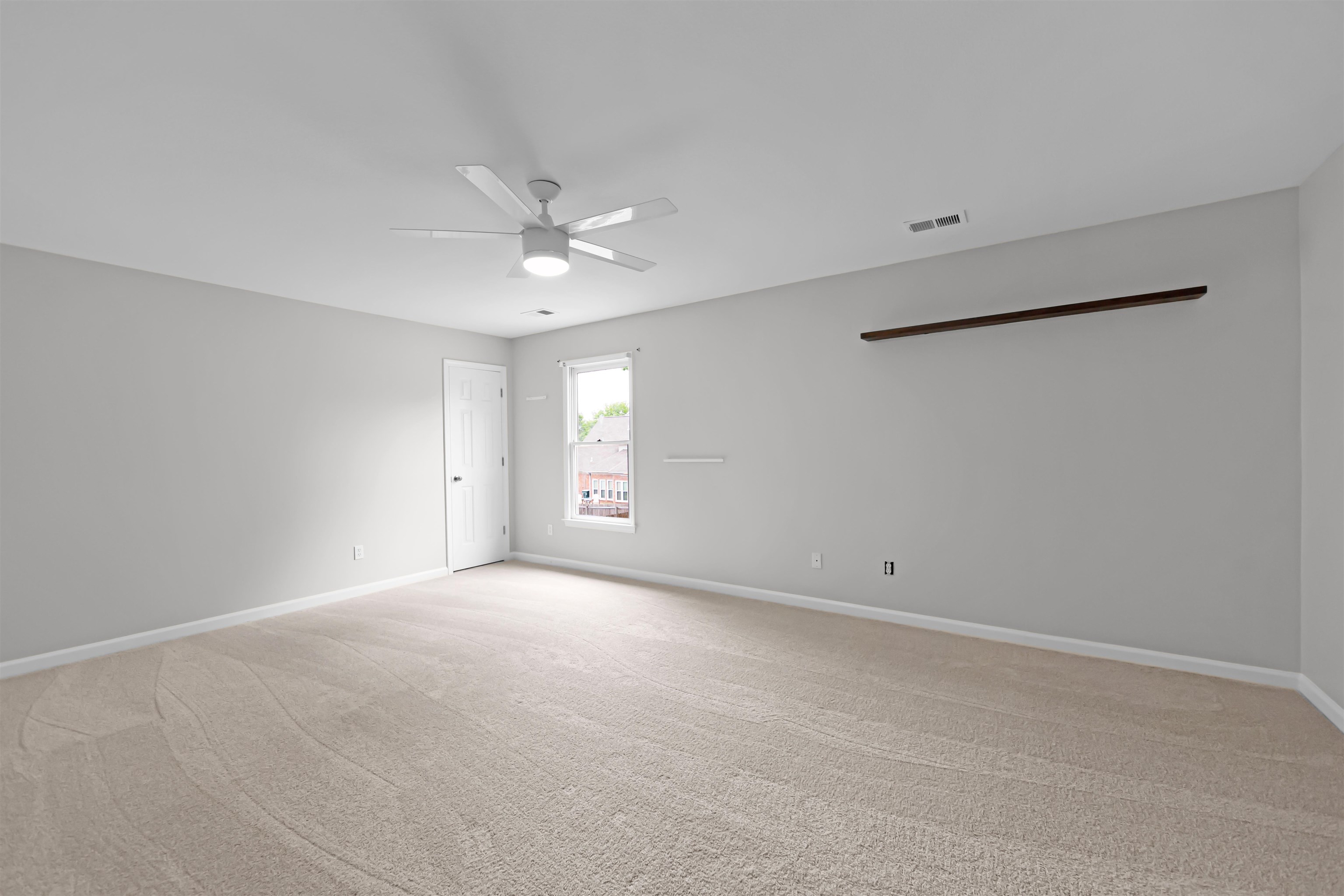 1331 Wahkin Road Collierville, TN 38017 - Photo 20 of 25 an empty room with windows and fan