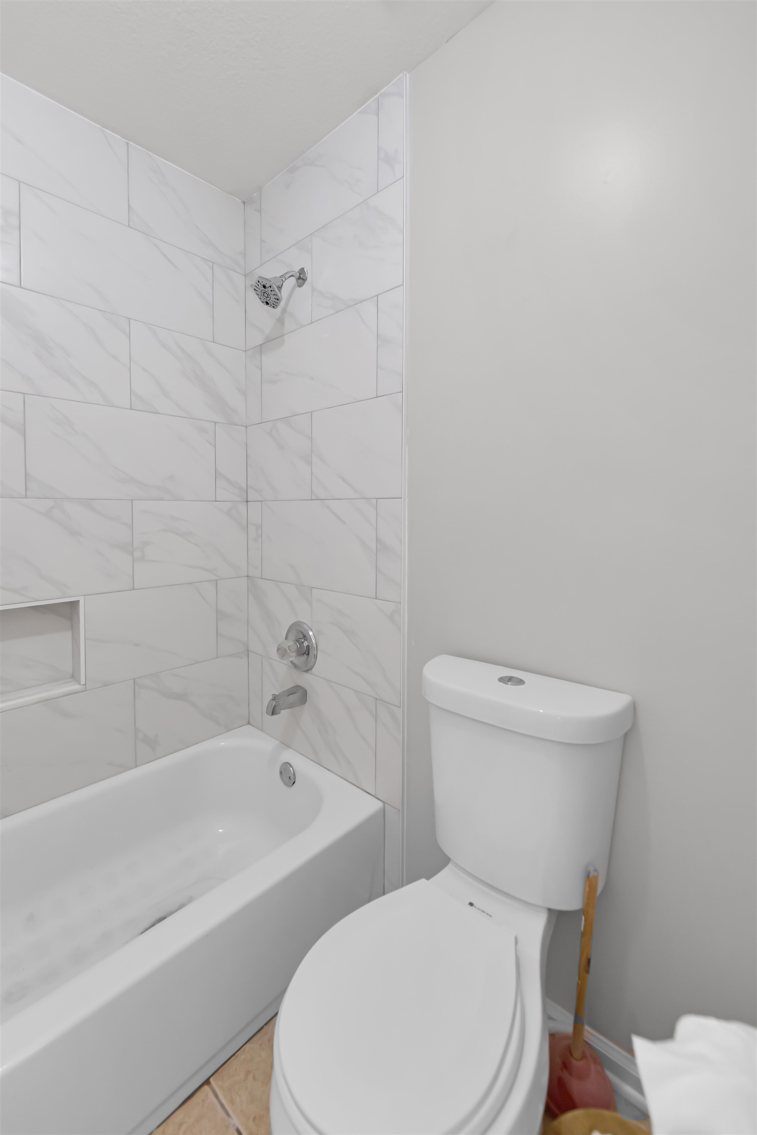 1331 Wahkin Road Collierville, TN 38017 - Photo 21 of 25 a white toilet and tub sitting next to a bathroom sink