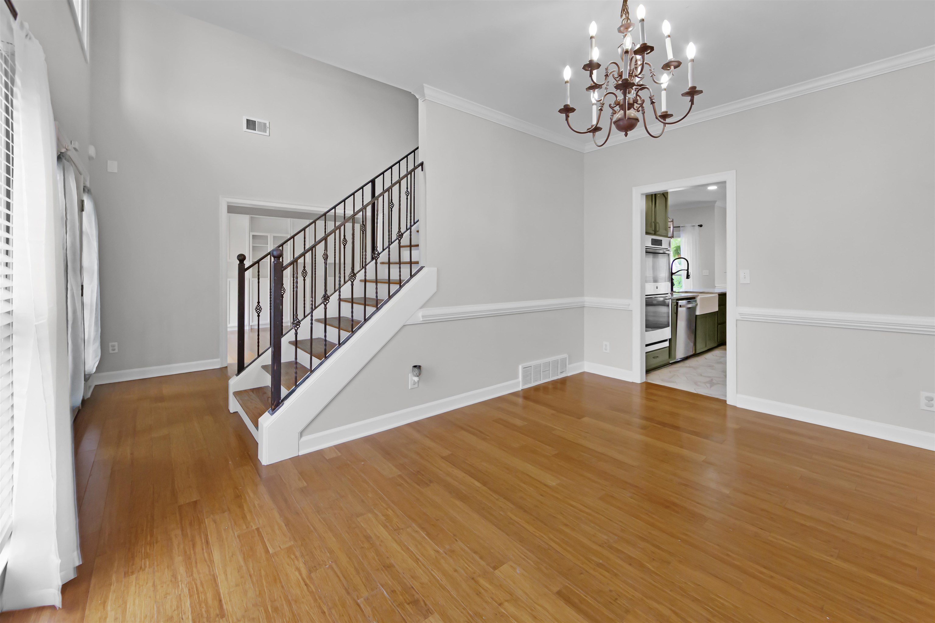1331 Wahkin Road Collierville, TN 38017 - Photo 3 of 25 a view of empty room with wooden floor and fan