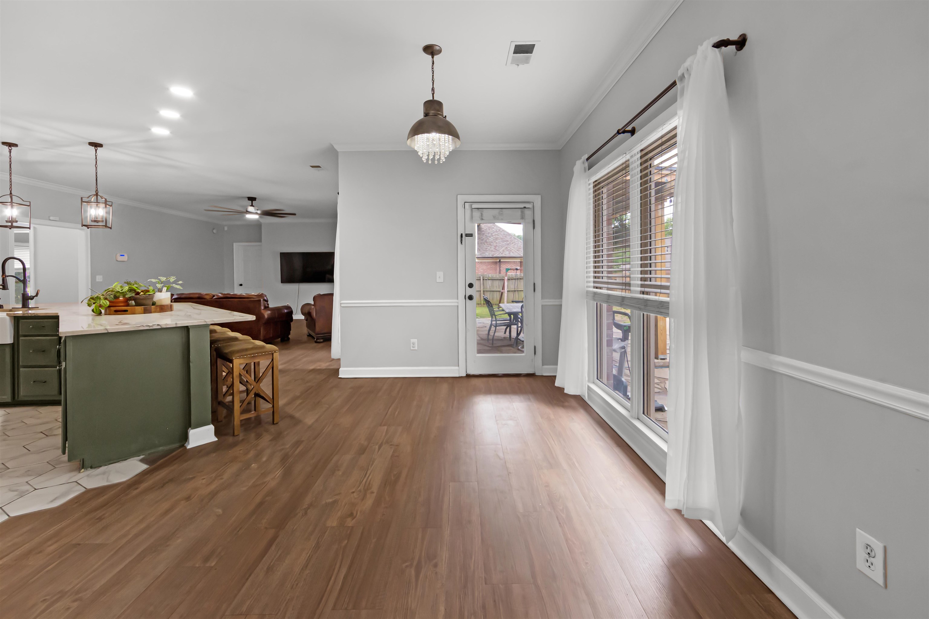 1331 Wahkin Road Collierville, TN 38017 - Photo 9 of 25 a view of a kitchen with furniture and a wooden floor