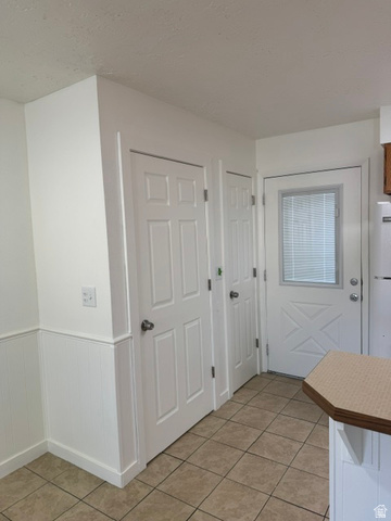 1797 West 950 North, Unit 2 St. George, UT 84770 - Photo 4 of 11 Tiled flooring with white beadboard wainscoting and multiple paneled doors
