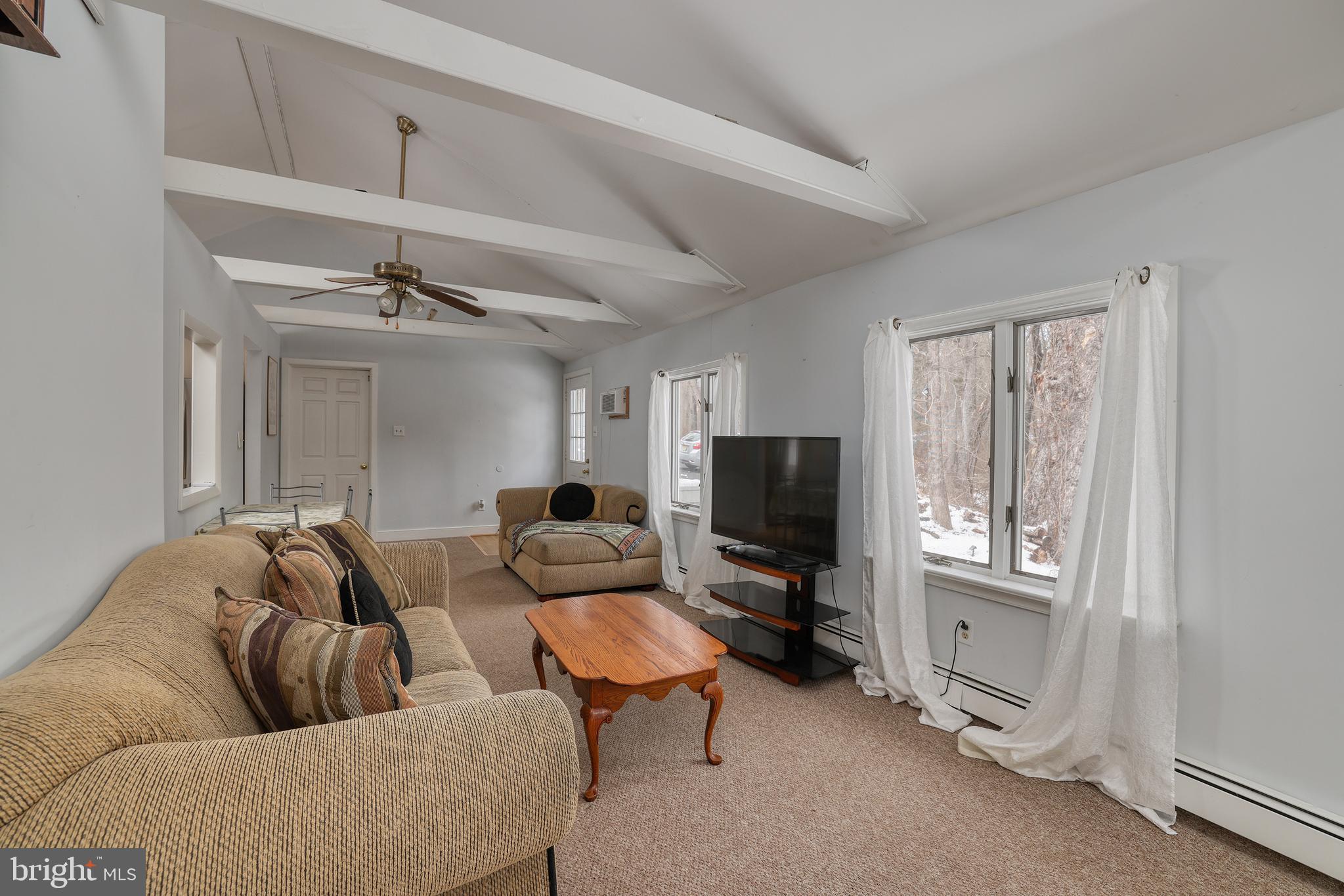 5496 York Rd., Unit CARRIAGE Doylestown, PA 18902 - Photo 16 of 34 The Vaulted Ceiling And Open Beams Add Character