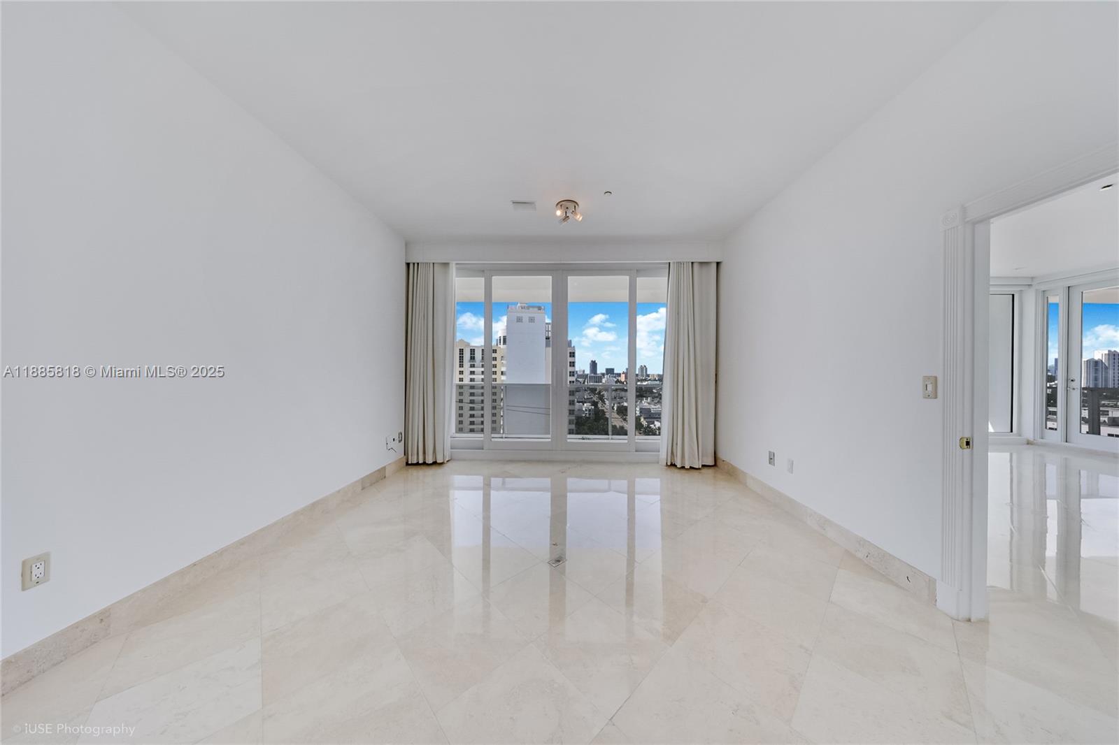 100 Lincoln Road, Unit PH12 Miami Beach, FL 33139 - Photo 12 of 41 wooden floor in an empty room with a window
