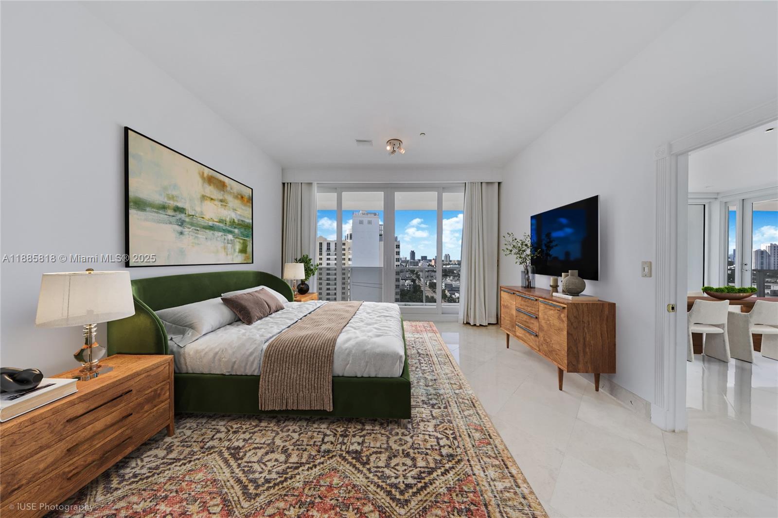 100 Lincoln Road, Unit PH12 Miami Beach, FL 33139 - Photo 14 of 41 a bedroom with a bed and a flat screen television