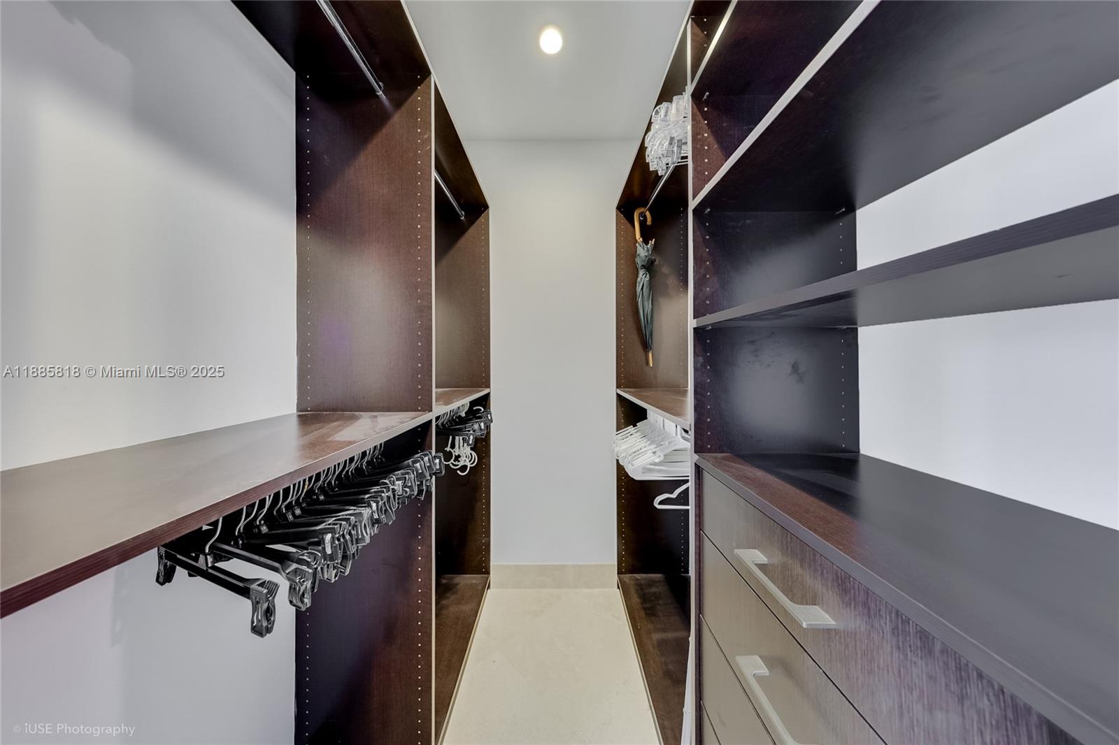 100 Lincoln Road, Unit PH12 Miami Beach, FL 33139 - Photo 19 of 41 a view of walk in closet with clothes and shoes