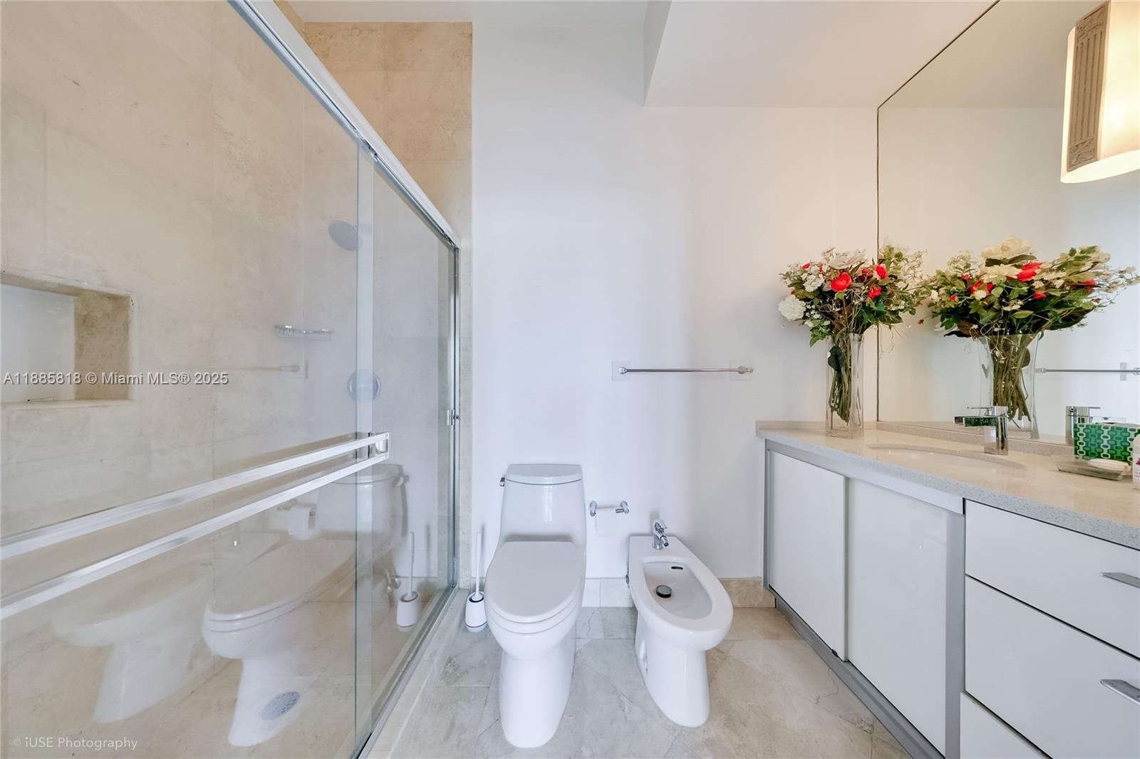 100 Lincoln Road, Unit PH12 Miami Beach, FL 33139 - Photo 23 of 41 a bathroom with a toilet sink and mirror