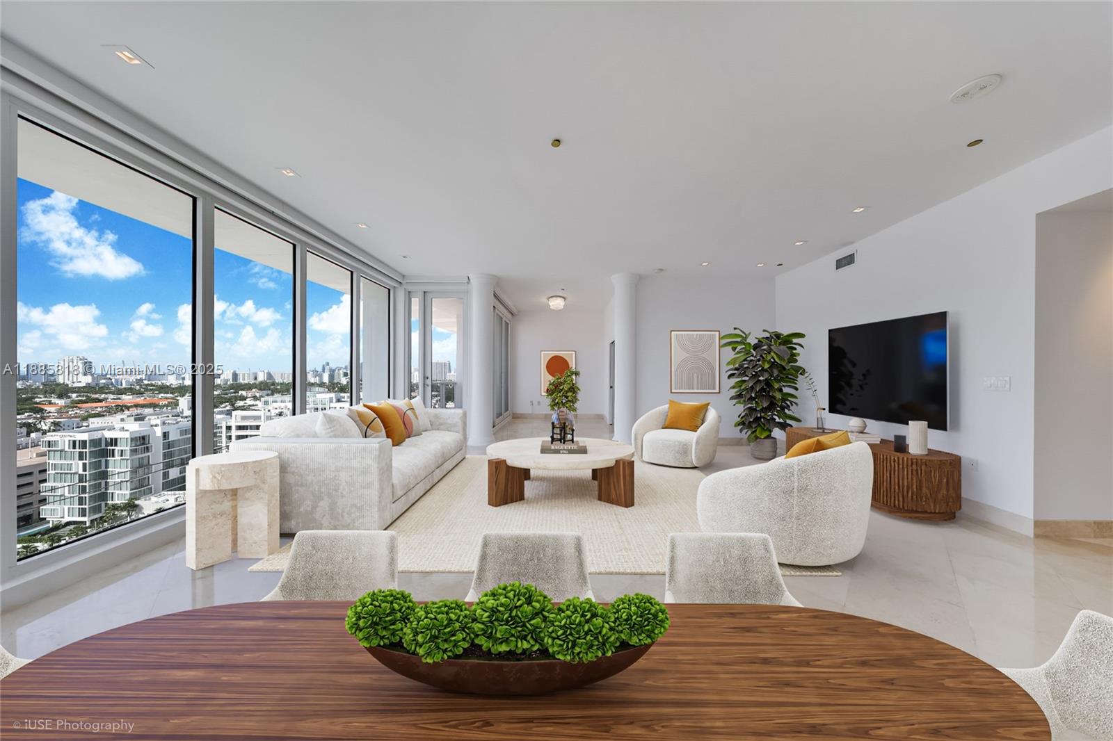 100 Lincoln Road, Unit PH12 Miami Beach, FL 33139 - Photo 6 of 41 a living room with furniture a flat screen tv and a large window