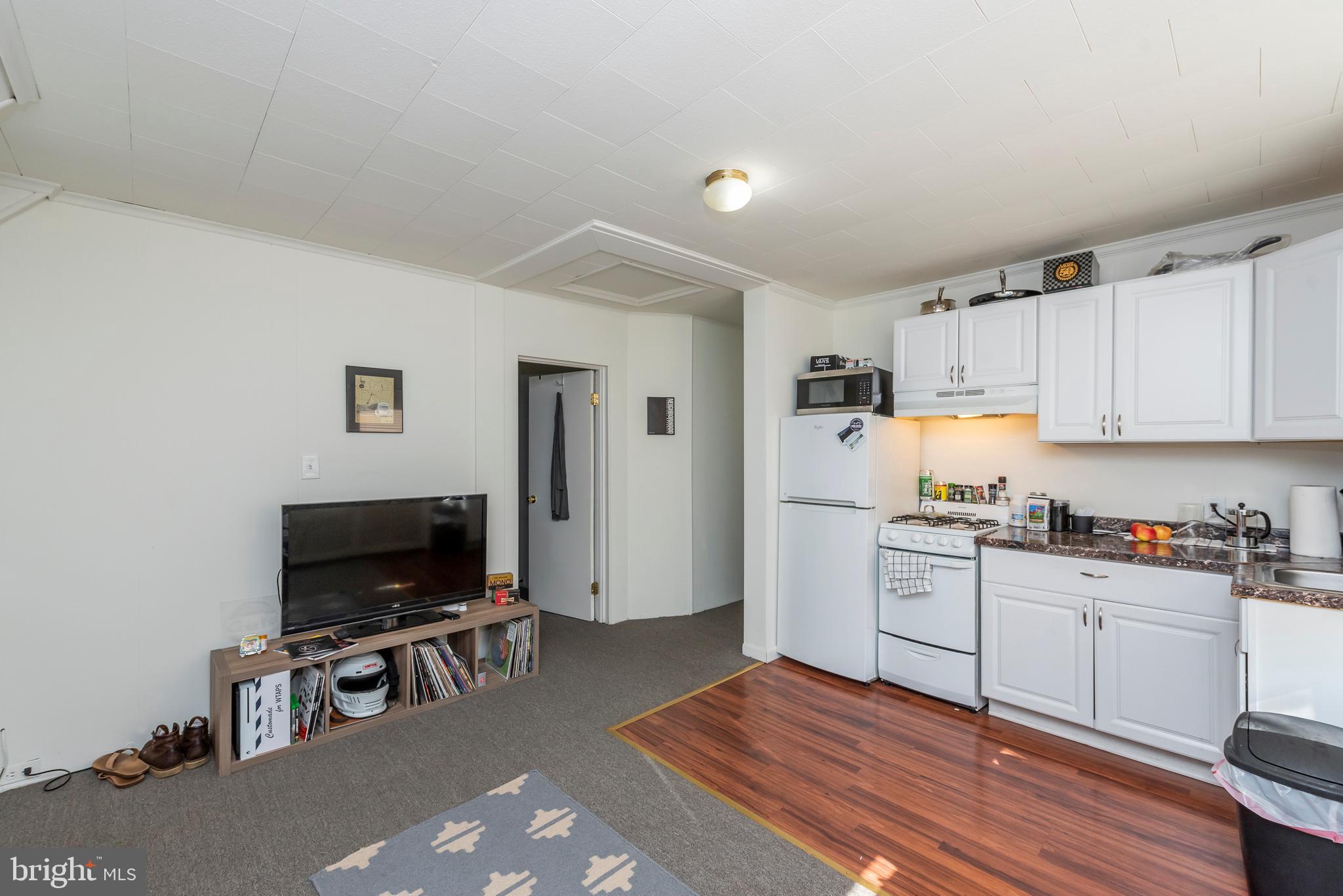 811 Dorchester Road Baltimore, MD 21229 - Photo 21 of 45 a kitchen with a refrigerator and a stove top oven