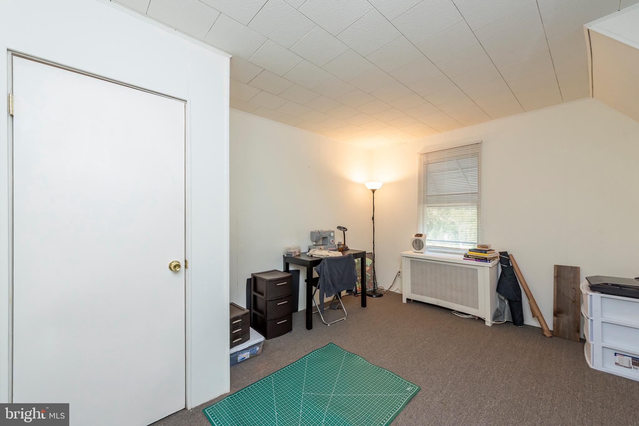 811 Dorchester Road Baltimore, MD 21229 - Photo 27 of 45 a view of workspace with furniture and window