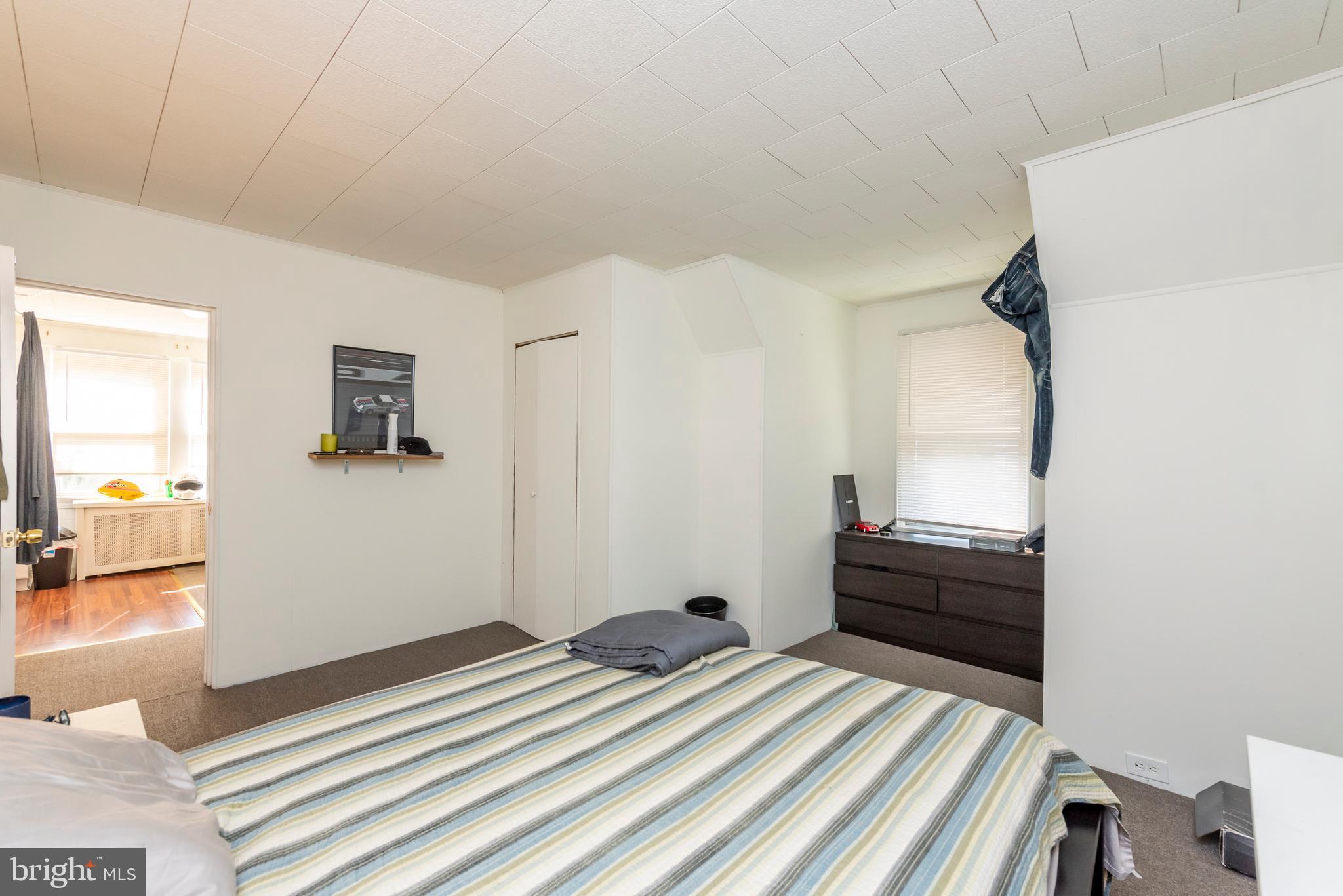 811 Dorchester Road Baltimore, MD 21229 - Photo 29 of 45 a bedroom with a bed and a view of bathroom