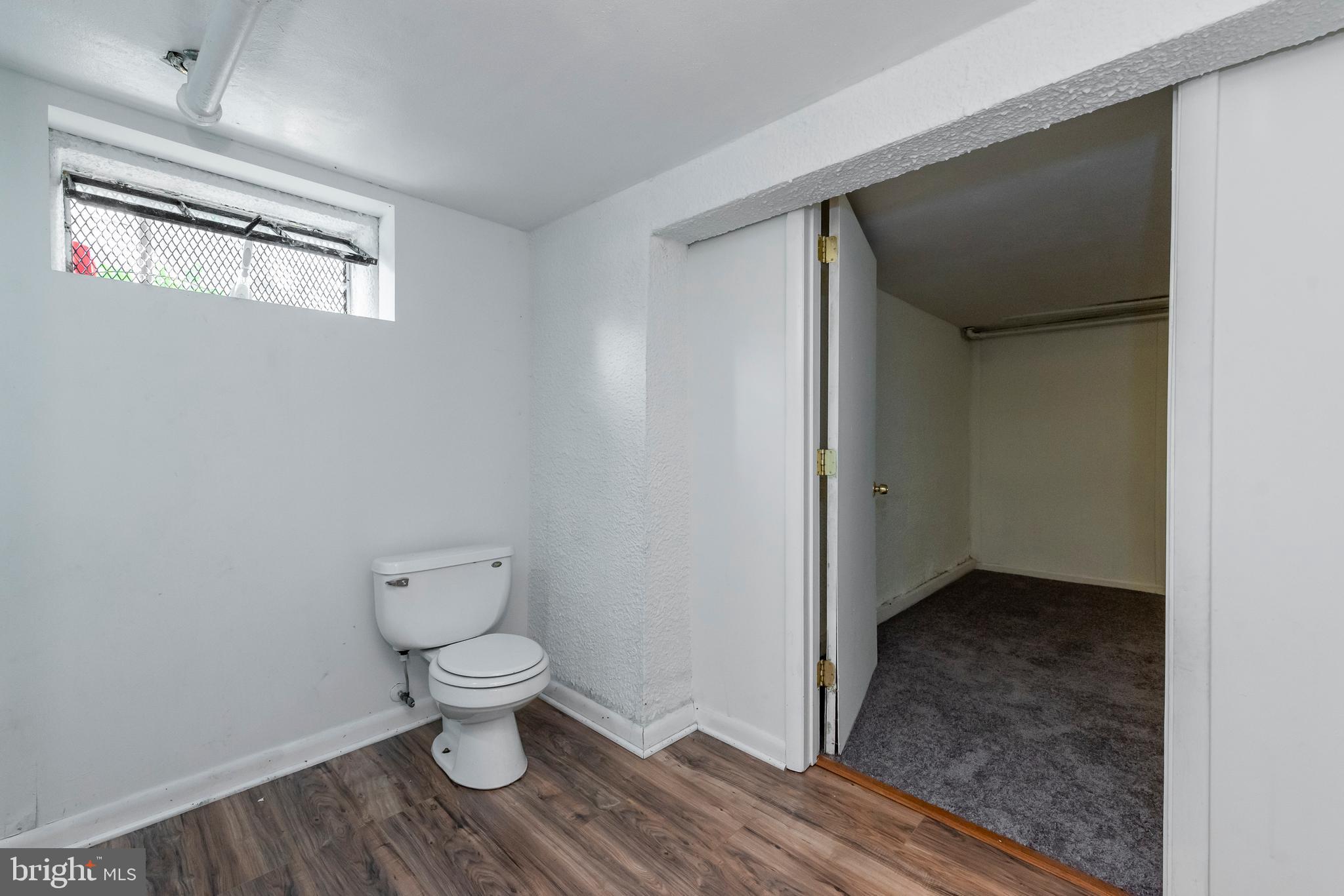 811 Dorchester Road Baltimore, MD 21229 - Photo 38 of 45 a bathroom with a toilet and a vanity
