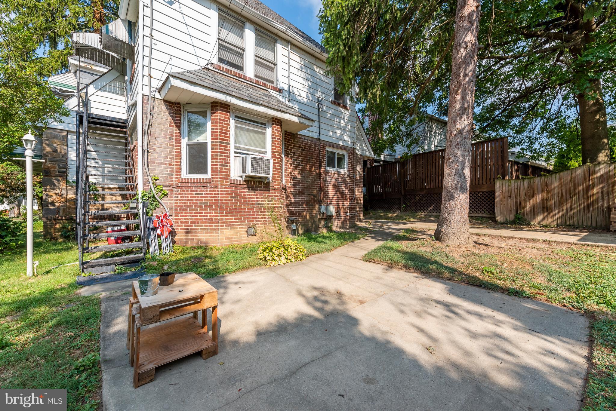 811 Dorchester Road Baltimore, MD 21229 - Photo 42 of 45 a backyard of a house with yard and outdoor seating