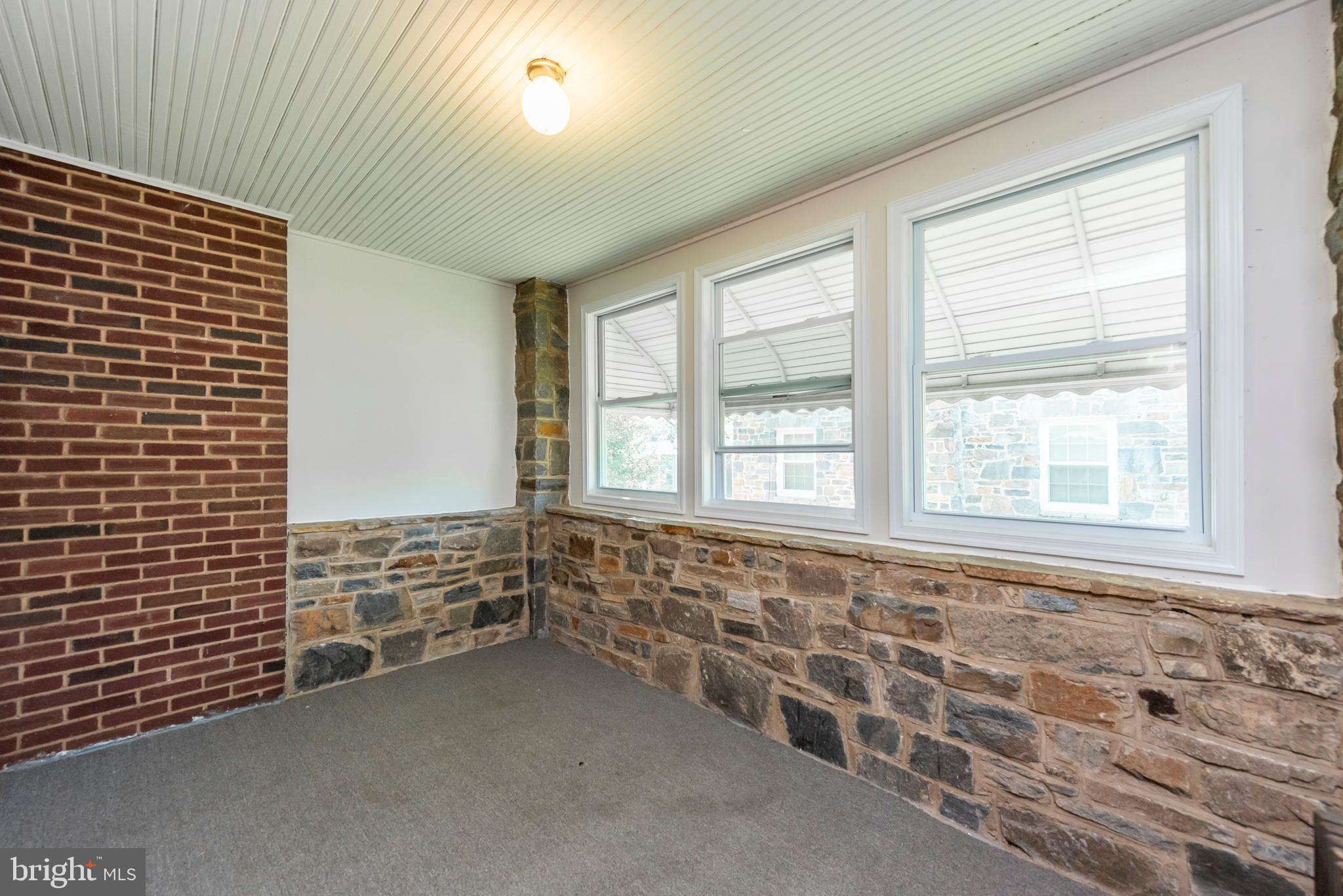 811 Dorchester Road Baltimore, MD 21229 - Photo 8 of 45 a view of an empty room with a window
