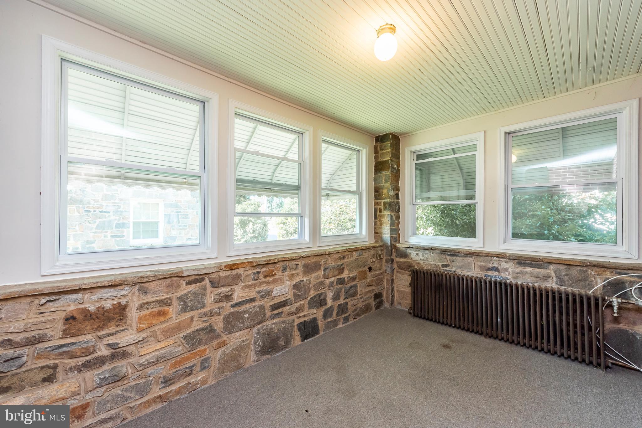 811 Dorchester Road Baltimore, MD 21229 - Photo 9 of 45 a view of an empty room with a window