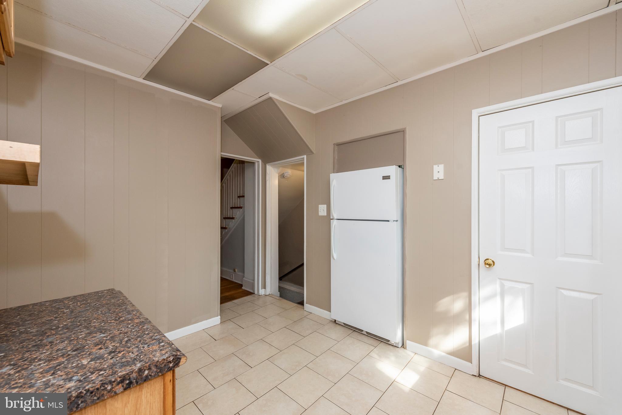 811 Dorchester Road Baltimore, MD 21229 - Photo 10 of 45 a view of kitchen and utility room