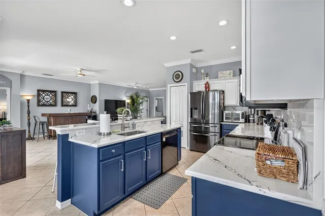a kitchen with cabinets a sink and appliances