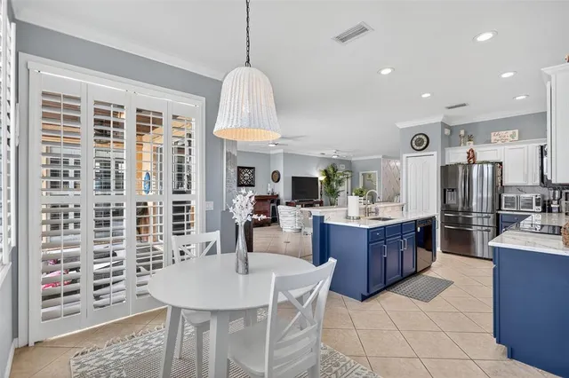 a dining room with furniture and window