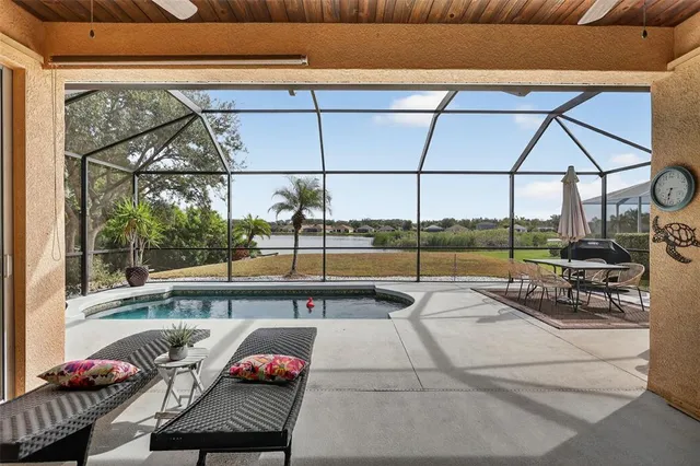a view of swimming pool with outdoor seating