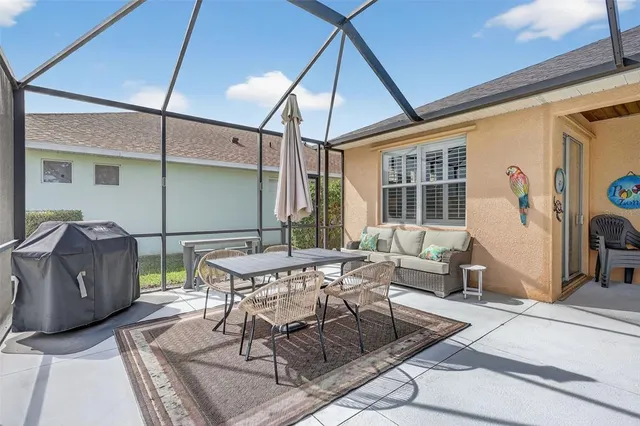 a view of a house with pool table and chairs