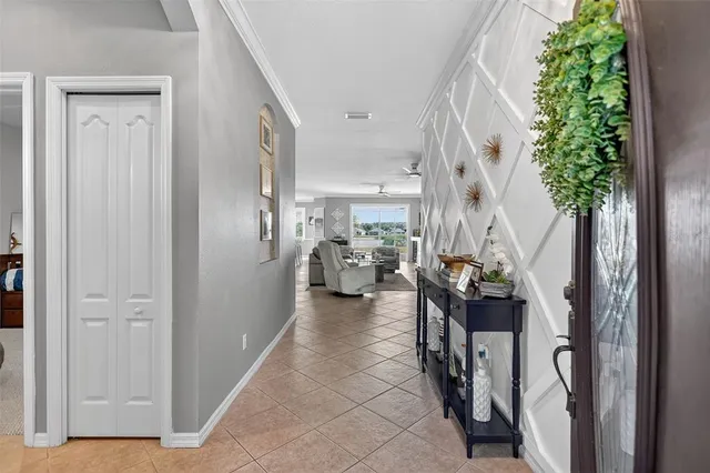 a living room with furniture and view of kitchen