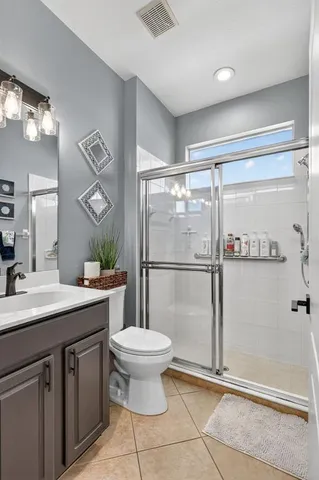 a bedroom with a bed and a chair