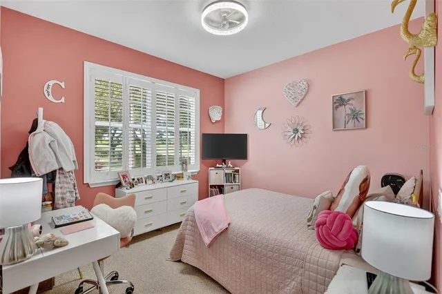 a bedroom with a workspace