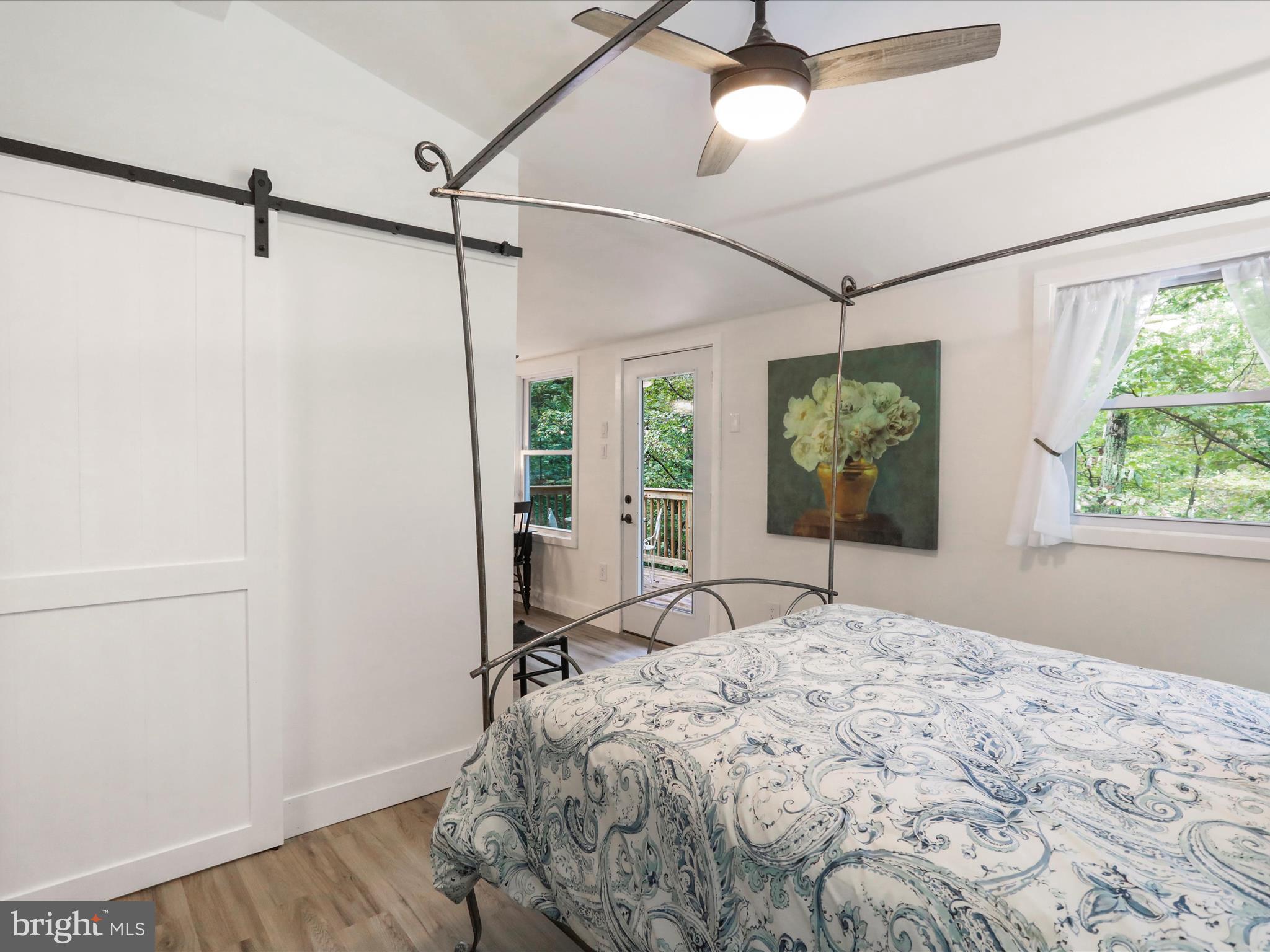 570 Cedar Road Strasburg, VA 22657 - Photo 14 of 47 a bed sitting in a bedroom next to a window