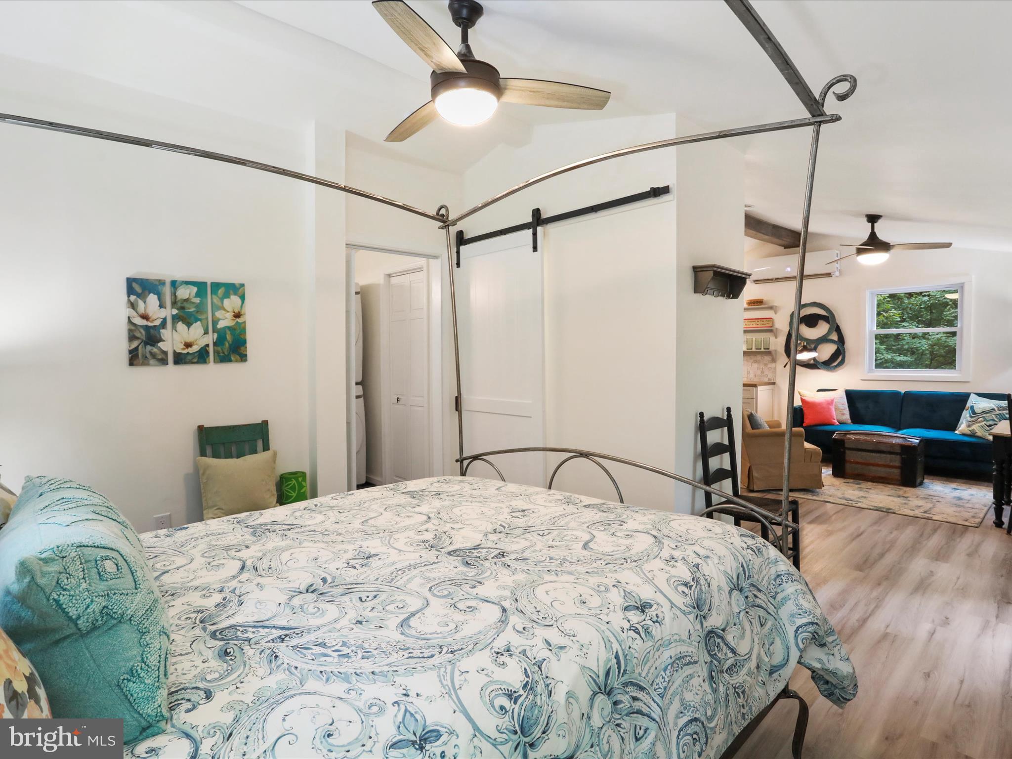 570 Cedar Road Strasburg, VA 22657 - Photo 15 of 47 a bedroom with a bed window and a table